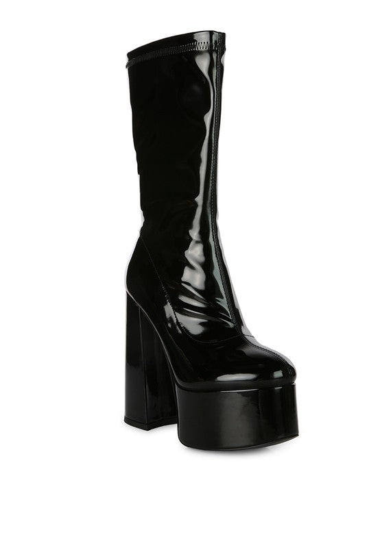 Glossy Patent Calf Boots crafted with shiny Patent PU outer material and a synthetic lining for a sleek, stylish look. Featuring a durable TPR outer sole, square toe, and block heel for comfort and stability. The side zipper opening and high heel ankle boot design make these boots perfect for any fashion-forward individual. Enjoy free shipping on ALL orders. Shop now!