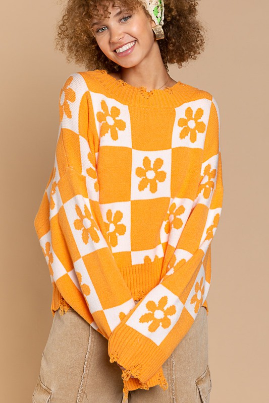 Stay warm and stylish with our Flower Knit Distressed Sweater, featuring a round neckline and oversized fit. Adorned with beautiful flower and checkerboard knitting, this cozy piece includes ribbed edges and distressed detailing for a trendy look. Perfect for colder weather. Free shipping on all orders. Shop now!