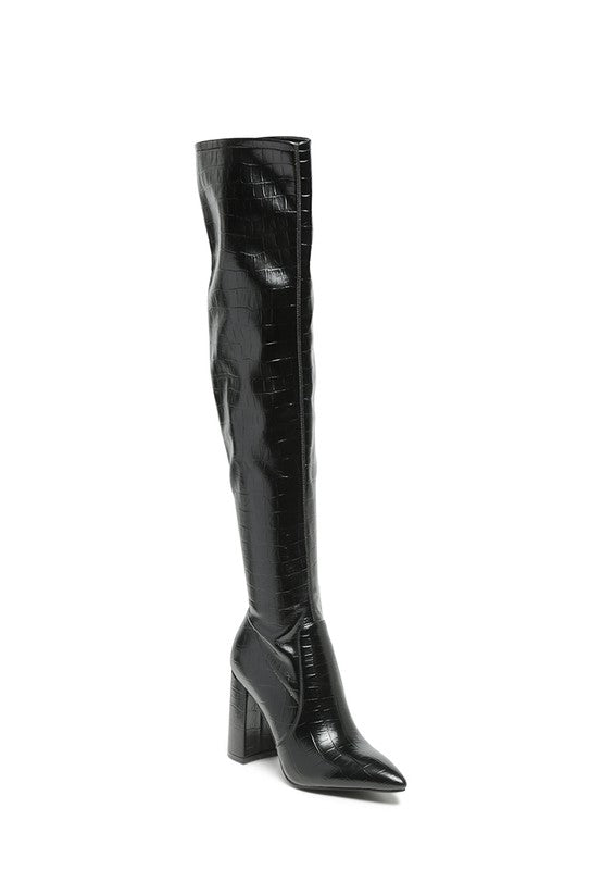 These knee-high boots feature a faux suede upper material, providing a textured look. The man-made lining material and rubber outer sole ensure durability and comfort. Complete with a stiletto heel, pointed toe, and zipper opening, these boots will elevate any outfit with style and sophistication. Enjoy free shipping on all orders. Shop now!