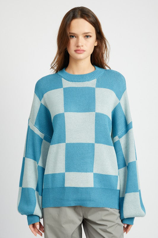 Embrace cozy style with our Oversized Checker Sweater featuring a crewneck design for easy wear. The puff long sleeves and ribbed cuffs ensure a comfortable fit, making it perfect for chilly days. Ideal for layering or wearing solo. Free shipping on all orders. Shop now!