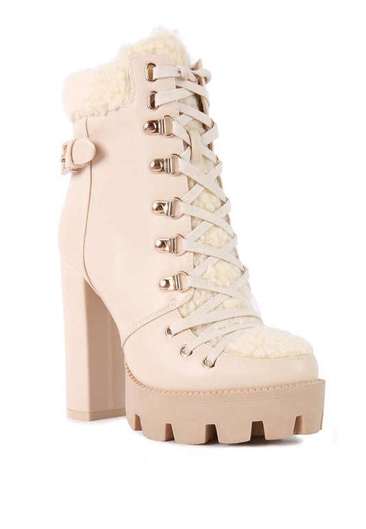 Lug Boots crafted from faux leather with a synthetic lining, featuring a closed pointed toe, lace-up detail, raised platform, and fur collar. Includes a side zipper for easy wear. Free shipping on all orders. Shop now!