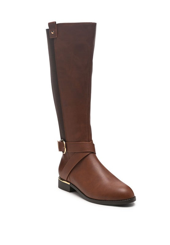 Durable knee-high boots with a side zipper for easy wear and an almond-shaped toe for a sleek look. Made from vegan leather, featuring buckle detail around the ankle and a closed round toe. Perfect for adding a touch of style to any outfit. Enjoy free shipping on ALL orders. Shop now!