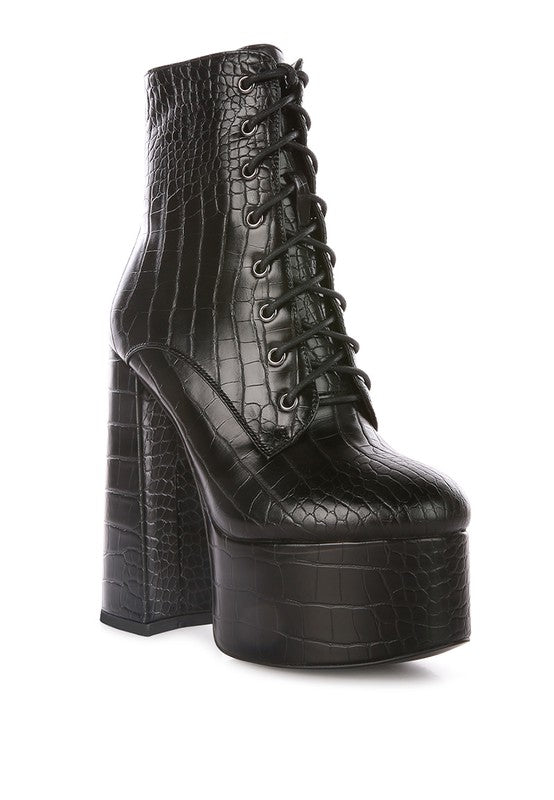 High Block Heel Boots crafted with Croc PU outer material, Synthetic lining, and a TPR outer sole. Featuring a closed pointed toe, side zipper opening, and lace-up detail, these boots blend sophistication with style. The raised platform and high heels offer an elegant lift, providing both comfort and flair. Enjoy free shipping on ALL orders. Shop now!