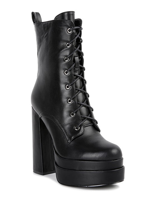 High Block Ankle Boots crafted with faux leather and synthetic lining. Featuring a closed-toe design, block heel, and TPR sole for stability and comfort. Includes a side zipper opening and lace-up detail for added style. Free shipping on all orders. Shop now!