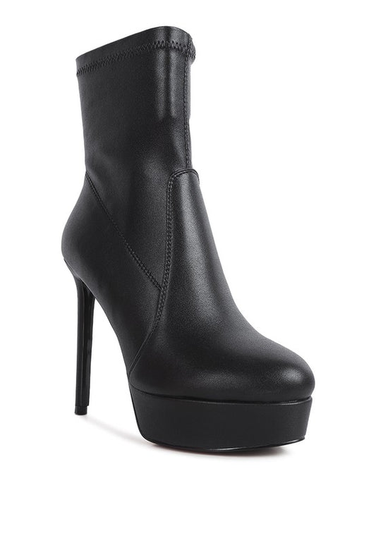 Faux leather ankle boots crafted from stretch PU, featuring a pointed toe and high heel for sophistication. Includes side zipper for easy wear and a synthetic lining for comfort. Ideal for colder months. Free shipping on all orders. Shop now!