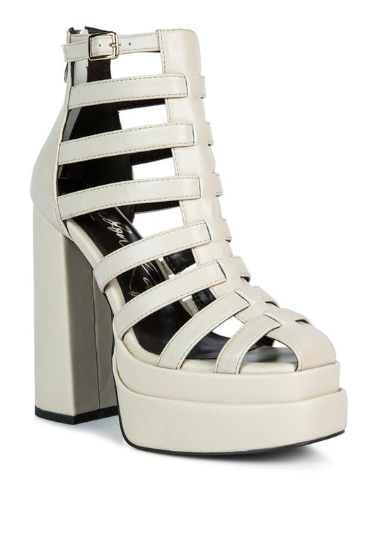 Cage Gladiator Bootie Sandals crafted with Metallic PU outer material and Synthetic lining. These fashion-forward sandals feature a closed pointed toe and stiletto heel for a sleek, sophisticated look. The side zipper opening and metal chain detail add an edgy touch, making them a must-have for any trendsetter. Enjoy free shipping on ALL orders. Shop now!