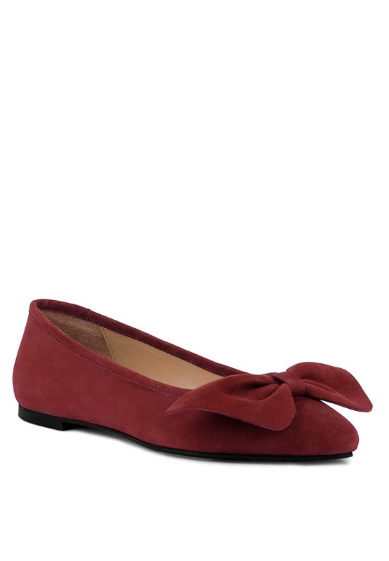 Bow suede ballerina flats expertly crafted with premium suede leather and a leatherette lining. Featuring an oversized leather bow on top and a closed almond toe for a refined look. The rubber outsole provides traction, and the lightly padded insole ensures all-day comfort. Ideal for any stylish fashionista. Free shipping on all orders. Shop now!