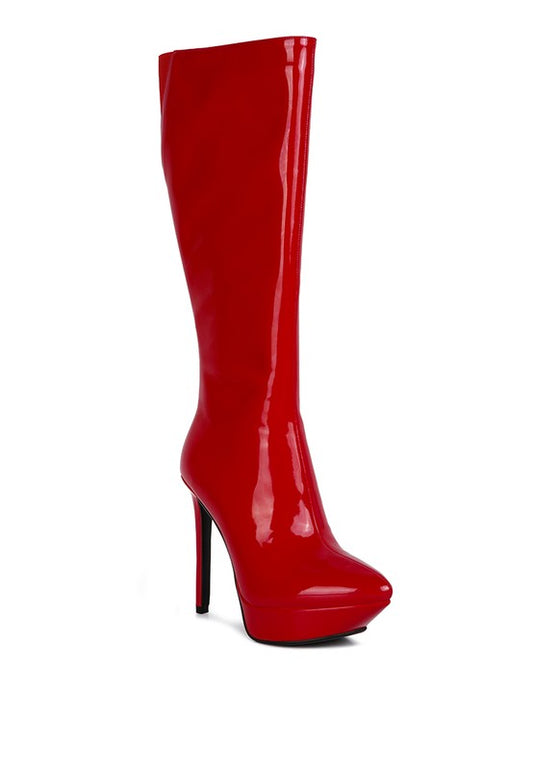 Patent Stiletto Boots designed to make a statement with a high heel and shiny patent leatherette material. Featuring a pointed toe, soft leatherette lining, and a rubber outsole for comfort and durability. The high pointed heel and platform, along with the side zipper detail, exude confidence and elegance. Enjoy free shipping on ALL orders. Shop now!