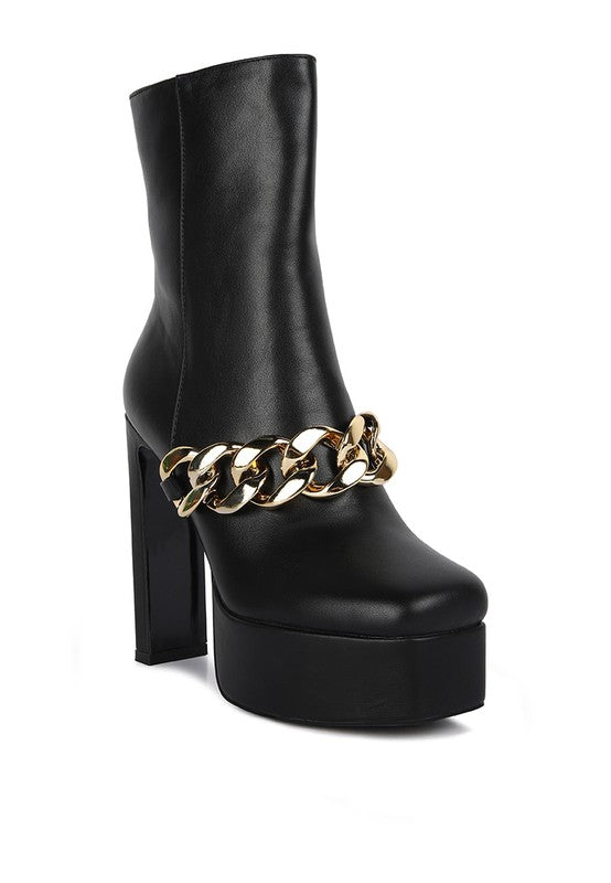 Chunky Chain Ankle Boots expertly crafted with a polyurethane outer and synthetic lining. Featuring a closed square toe and block heel, these boots offer both style and comfort. The side zipper opening allows for easy closure, while the metal chain detail adds a touch of edginess. Perfect for any occasion, these boots will elevate your style game. Enjoy free shipping on ALL orders. Shop now!