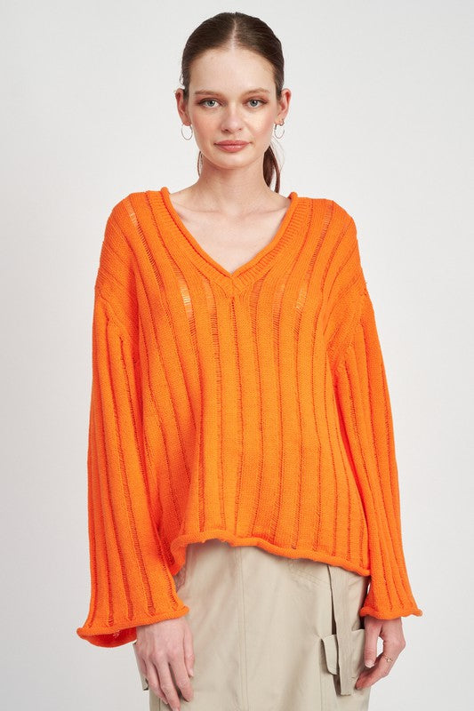 This Ribbed Knit Sweater features a V neckline and long bell sleeves for a stylish and comfortable fit. The rolled-up rib finish adds texture and dimension to the soft knit fabric. Stay warm and fashionable with this versatile sweater. Fabric contents: 60% Cotton, 40% Acrylic. Enjoy free shipping on all orders. Shop now!