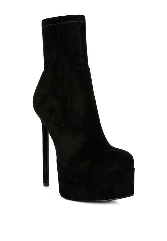 Microfiber ankle boots with a side zipper and closed toe design. Featuring a stiletto heel and high platform for a sleek look. Lightly padded insole and synthetic lining ensure comfort. Free shipping on all orders. Shop now!