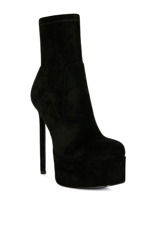 Microfiber ankle boots with a side zipper and closed toe design. Featuring a stiletto heel and high platform for a sleek look. Lightly padded insole and synthetic lining ensure comfort. Free shipping on all orders. Shop now!