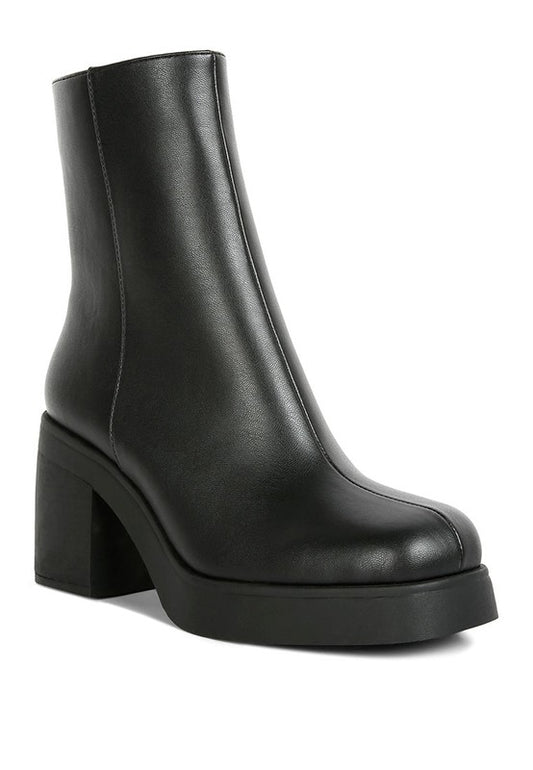 Ankle Platform Boots made with patent PU and a TPR outer sole for durability and comfort. Featuring a closed round toe, high heel, lightly cushioned insole, and side zipper opening, these boots are a trendy and supportive wardrobe staple for any woman. Enjoy free shipping on ALL orders. Shop now!