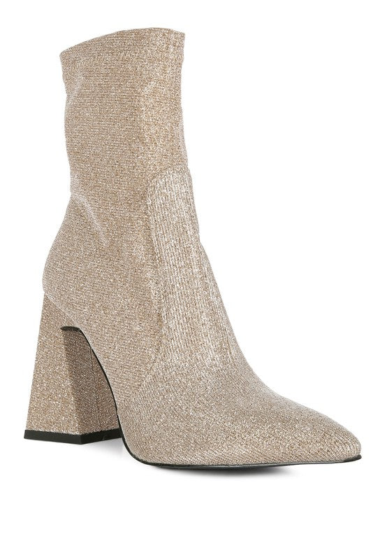 Shimmer Ankle Boots that are a must-have for any fashion-forward wardrobe. Crafted with shimmer textile outer material and a synthetic lining for all-day comfort. Featuring a closed pointed toe, block heel, and side zipper opening, these boots perfectly combine style and function. Enjoy free shipping on ALL orders. Shop now!