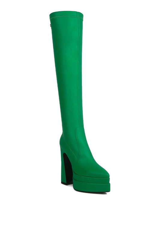 Platform Knee High Boots with stretch PU outer material for a perfect fit, synthetic lining for all-day wear, and a durable TPR outer sole. Featuring a closed pointed toe, high platform heel (4.5 inches), and side zipper detail with pull tabs for easy on and off. Expertly crafted for both style and comfort. Enjoy free shipping on all orders. Shop now!