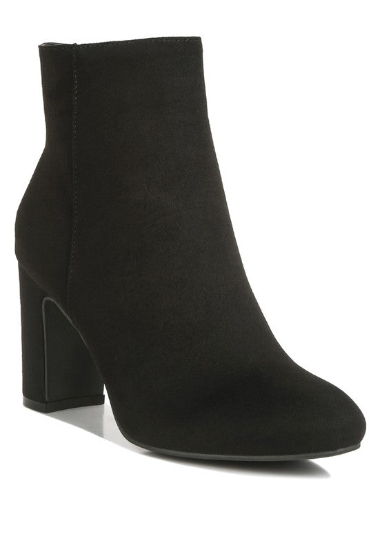 Eco-friendly Microfiber Block Ankle Boots with a recycled microfiber upper material and TPR outer sole. The closed almond toe and high block heels offer comfort and support, while the lightly cushioned insoles and side zipper closure provide added convenience. Upgrade your footwear with stylish, sustainable fashion. Enjoy free shipping on ALL orders. Shop now!