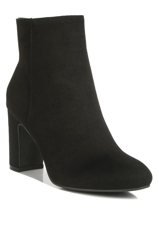 Eco-friendly Microfiber Block Ankle Boots with a recycled microfiber upper material and TPR outer sole. The closed almond toe and high block heels offer comfort and support, while the lightly cushioned insoles and side zipper closure provide added convenience. Upgrade your footwear with stylish, sustainable fashion. Enjoy free shipping on ALL orders. Shop now!