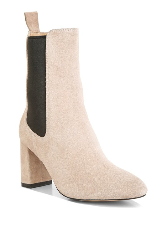 Suede Ankle Chelsea Boots designed to elevate your shoe collection, crafted with a suede upper material and TPR outer sole for durability and comfort. Featuring a light cushion insole and block heels for added support, these boots also include elasticated gussets, pull tabs, and a high ankle design, combining style and functionality for any occasion. Enjoy free shipping on ALL orders. Shop now!