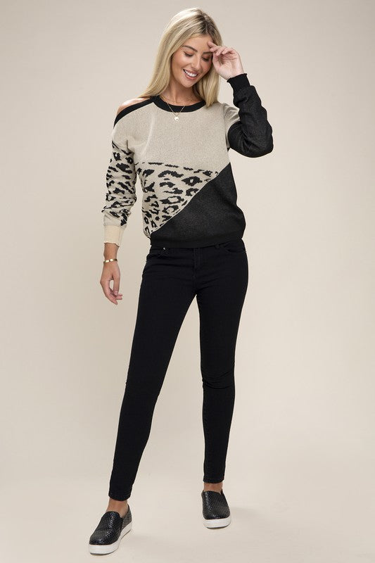 Trendy Cold-Shoulder Sweater featuring a leopard print color block and edgy cut-out details. This classic ribbed crewneck design has drop shoulders and long sleeves, making it perfect for any occasion. Crafted from 100% polyester for warmth and style. Free shipping on all orders. Shop now!