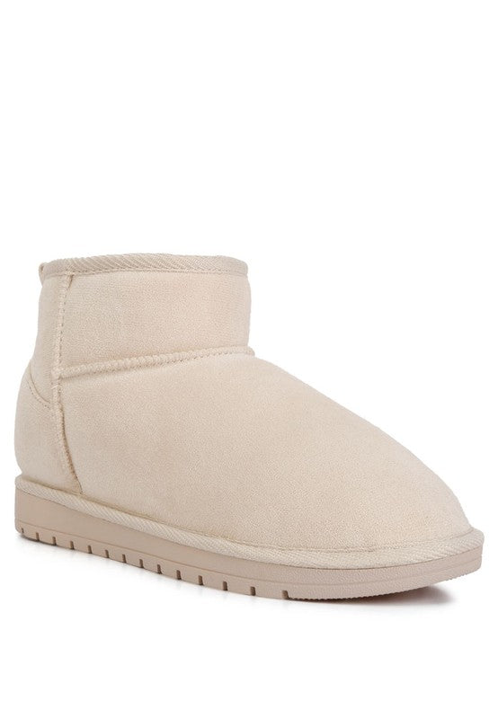 Ankle Flat Winter Booties made with micro suede upper material and a rubber outer sole for comfort and durability. Featuring a light cushioned insole, closed rounded toe for warmth and protection, and pull tabs for easy on and off. The flat design and stitch paneling detail add both style and practicality. Enjoy free shipping on all orders. Shop now!