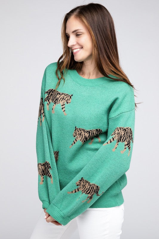 Fierce and stylish, this sweater features a striking tiger print with ribbed cuffs for a cool look. Designed with a round neckline and long sleeves, it offers both comfort and versatility at hip length. Perfect for effortless fashion. Fabric contents: 62% acrylic, 38% polyester. Free shipping on all orders. Shop now!