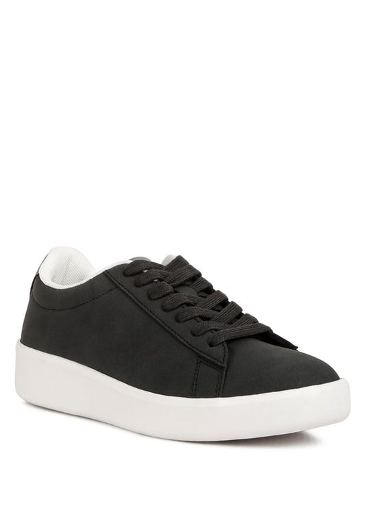 Stylish Minky Lace Up Sneakers made with premium faux leather and suede. Features a closed rounded toe, contrasting back panel, and delicate embroidery detail. Equipped with lightly cushioned insoles and a chunky flatform design for comfort. Ideal for upgrading your casual shoe collection. Free shipping on all orders. Shop now!