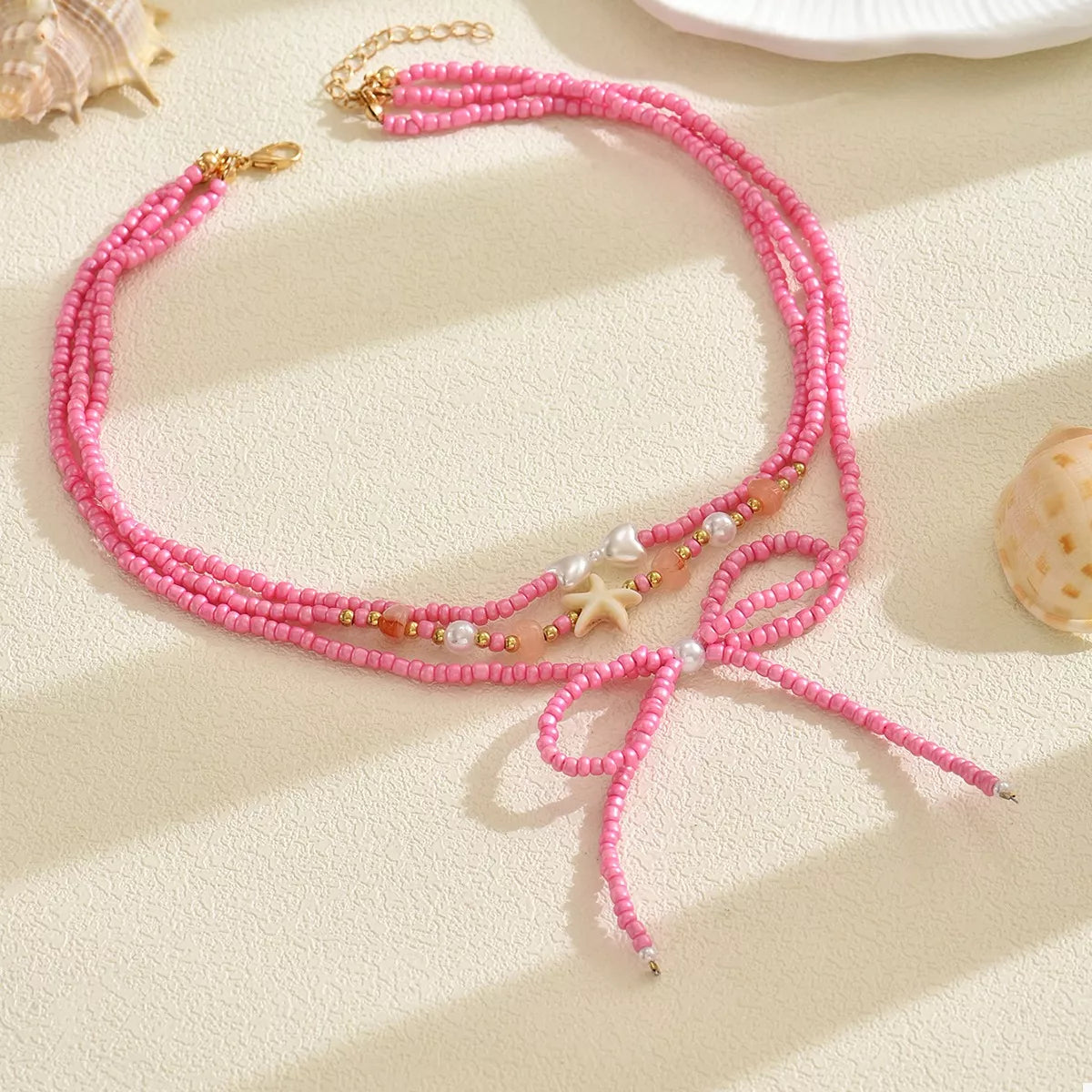 Beaded Three-Layered Necklace with Bow and Starfish Charms - alternate necklace view