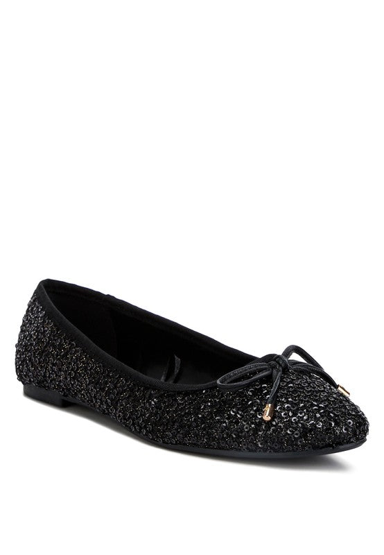 Sequin Ballet Flats with a faux leather upper, closed almond toe, and flat heels. The design includes bow and sequin embellishments for added elegance, and a durable TPR outer sole for comfort and style. Free shipping on all orders. Shop now!