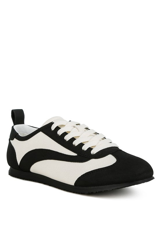 Introducing our Contrast Lace Up Sneakers, expertly crafted from durable faux leather with a TPR outer sole. These sneakers feature a flat heel and closed round toe for ultimate comfort. The stylish lace-up design and paneling details add a fashionable touch, while the convenient pull tabs make them easy to slip on and off. Elevate your casual footwear collection with these must-have sneakers! Free shipping on all orders. Shop now!