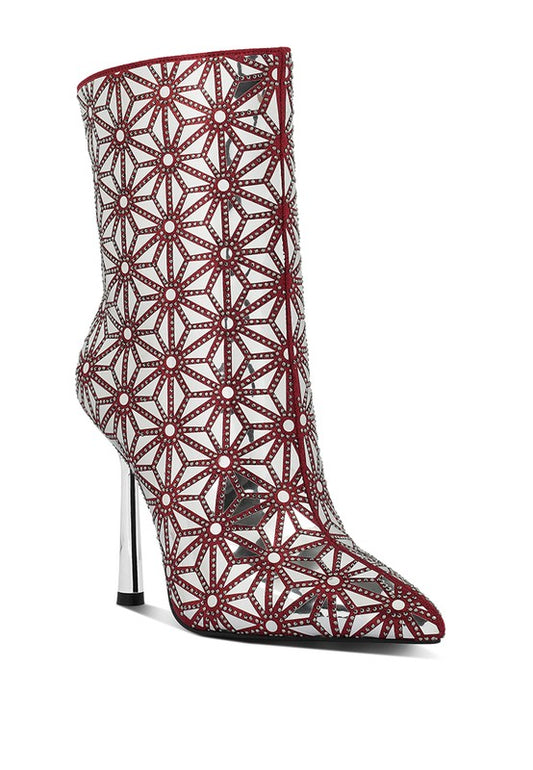 Embellished High Ankle Boots crafted with faux suede material and resin outer sole. Closed pointed toe and metallic stiletto heel add sophistication, while patterned mirror embellishment offers a glamorous touch. Lightly cushioned insoles and zipper closure for comfort and convenience. Heel Height: 4.1 inches. Free shipping on all orders. Shop now!