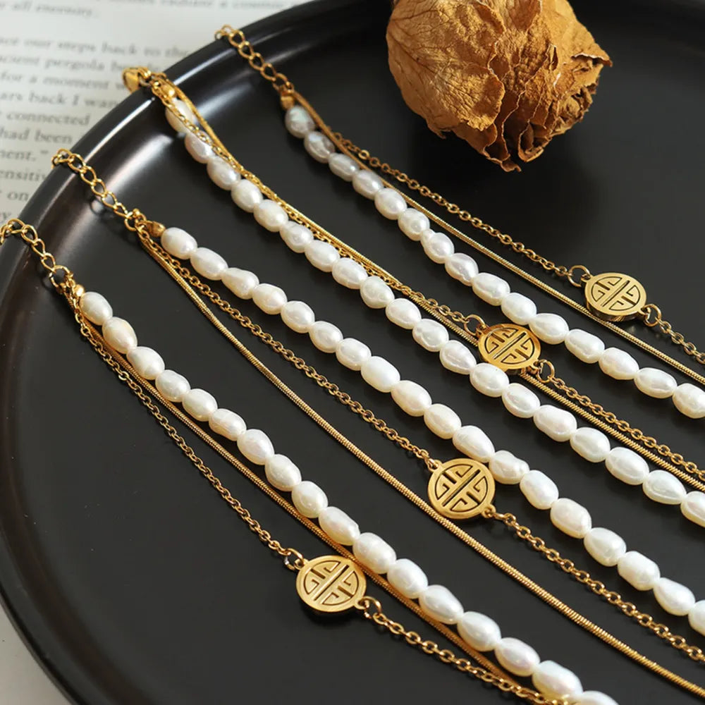 Titanium Steel Three-Layered Pearl Bracelet in Gold - women's pearl bracelet