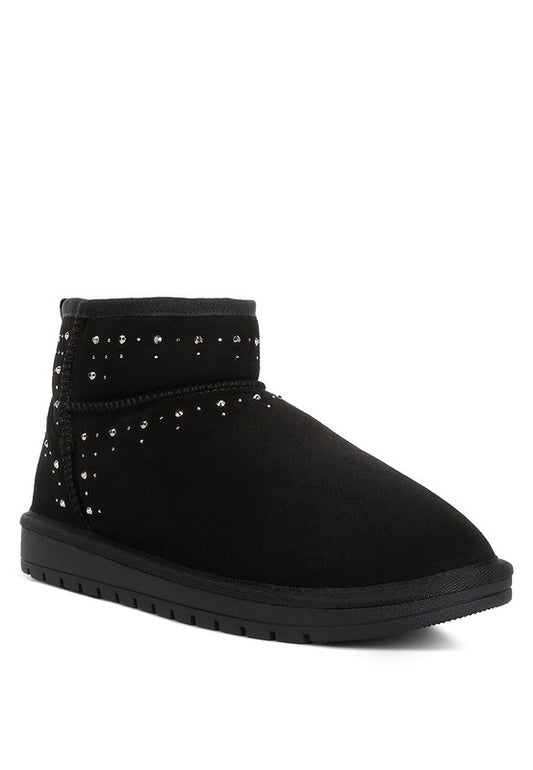 Rhinestone Embellished Booties crafted from premium suede with a durable rubber sole for maximum comfort. Featuring a closed rounded toe design and easy slip-on style for practicality, with pull tab and lug sole details adding sophistication. Lightly padded insoles ensure all-day wearability. Elevate your look with stunning rhinestone embellishments. Enjoy free shipping on all orders. Shop now!
