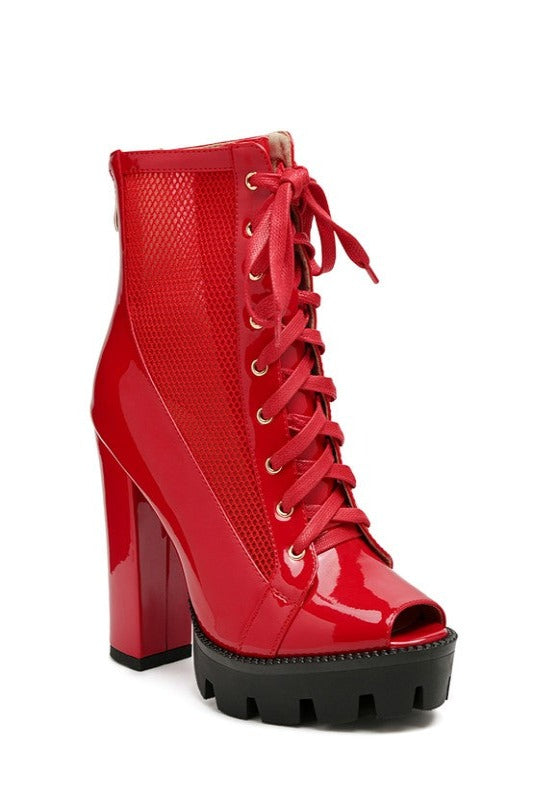 Patent Lace-Up Boots featuring a mesh panel for added style and breathability, along with a lace-up detail for a secure and customizable fit. The block-heeled chunky design and back zipper opening ensure comfort and easy on/off wear. Made with high-quality polyurethane, microfiber lining, and a durable TPR outer sole. Step out in style and functionality with these Lace-Up Style Peep Toe Boots. Enjoy free shipping on all orders. Shop now!