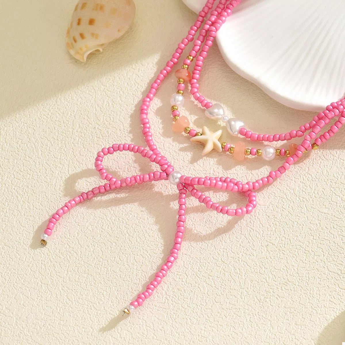 Beaded Three-Layered Necklace with Bow and Starfish Charms - alternate necklace view